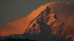 The Annapurna Sanctuary trek takes me to the other side of the Machapuchare, from where it looks like a fishtail with its double-peaked summit ridge.