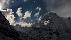 Annapurna South from the Base Camp of Annapurna with fog and clouds moving in during the late afternoon.