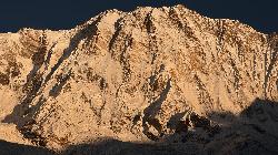 Morning sun illuminating the vertical south face of Annapurna I (8'091 m).