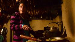 Great atmosphere in the kitchen where fresh dal baht and vegetable curry mark the end of a strenuous day.