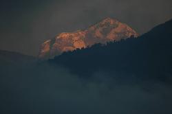 Mist on the lake and the illuminated peak of Dhaulagiri (8'167 m).