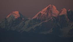 The last light turns the snow pink.