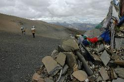 Kitchen crew descending from the Gela La into the barren valleys of Namgung.