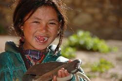 Portrait of young girl in Do who opens the door to the monastery.