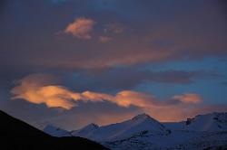 Strange light in the morning announces a day of foul weather just as we leave for the difficult pass into the Sangtha valley.