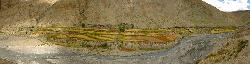 Panorama of characteristic village below Saldang, with a yak caravan at the right on the way to Do Tarap. Destination is the same, speed isn't. They arrive there days ahead of us, since they walk deep into the night.