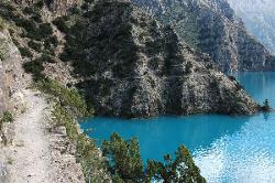 Trail above the lake, often it's a vertical 30, 50 feet down into the cold water.