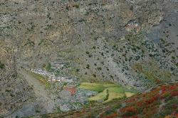 Look down into the Namgung valley where a few terraced barley fields make survival for the small village possible.