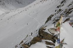 Jamie coming to the last high pass; camp in the background.