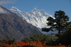 Mount Everest and Lhotse; high summits above the colorful pastures.