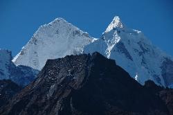 Kangtega summits rising above the black faces of lesser peaks.