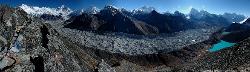 Panorama Gokyo Ri with 4 peaks over 8'000 meters; and countless others almost as high. Gokyo and its lodges lie at the foot of the blue lake at the right.