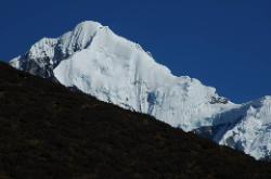 Pandim (6'691m) rises over the ridge on a beautiful morning.