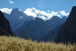 We'll soon walk through the gorges at the foot of the jagged cliffs.