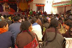 The courtyard of the new monastery at Taktok is filled with people. An important lama from Simla arrived; people have gathered to listen to his speech.