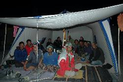 Group picture at end of trek; the horsemen; kitchencrew; and tourists in the back of the dining tent.