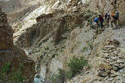 A narrow trail with interesting bridges that span over chasm need to be crossed; once more I am surprised about the agility of our horses.