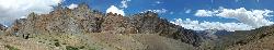 Panorama shortly before reaching campsite; we stop and enjoy the stunning contrast between the rugged canyons; the barren hills and the colourful isolated fields of Yulchung..