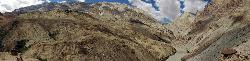 Panorama of horses climbing up to Nyerak; with Zanskar river at the right.