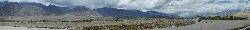 Panorama of Indus valley with monastery on a hill.