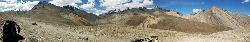 Panorama on the way to the pass; barren slopes in stunning colours.