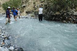 The river is not deep; but the fast-flowing icy water does require some care when crossing it barefoot.