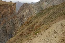 Another slope with a narrow trail; Parfi La in the back.