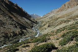 On the third day we face the first official pass. Sirsir La lies hidden left of the triangular hill at the end of the valley.