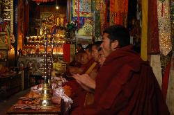 Solemn atmosphere during the chanting and playing of instruments.