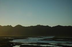 Leaving Shigatse very early in the morning; the rising sun turns the scenery into a golden light.