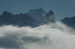 Siniolchu's east face rises above the mist of the Thanggu valley.