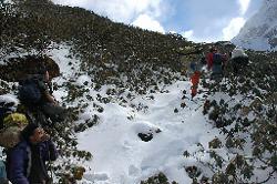 It is a strenuous walk through the snow, and we often rest.