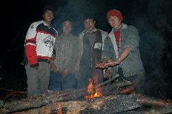 The porters collect mainly dead wood to make a fire for the night. They did not bring a tent, and usually sleep out in small caves.