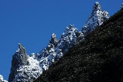 Crags rise above the steep hillsides.