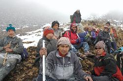 Wind and snow drives us off the pass without a stop, some minutes down the other side we take a break. a sense of relief and achievement is shared by everybody.