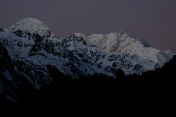 My alarm clocks wakes me at 5.30 when Kanchenjunga, the triangular peak in the mid-right, still lies in darkness.