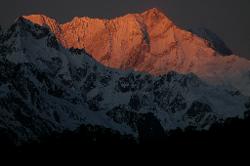 Some minutes later, the entire eastern face catches the orange colour.