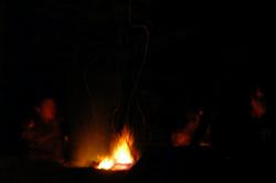 I go to bed early after dinner, the porters sit around the fire for much longer before crawling under the heavy blankets or army sleeping bags they brought with them.